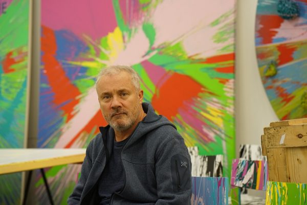 Images of Damien Hirst creating spin paintings in his studio in April 1995, both as below: